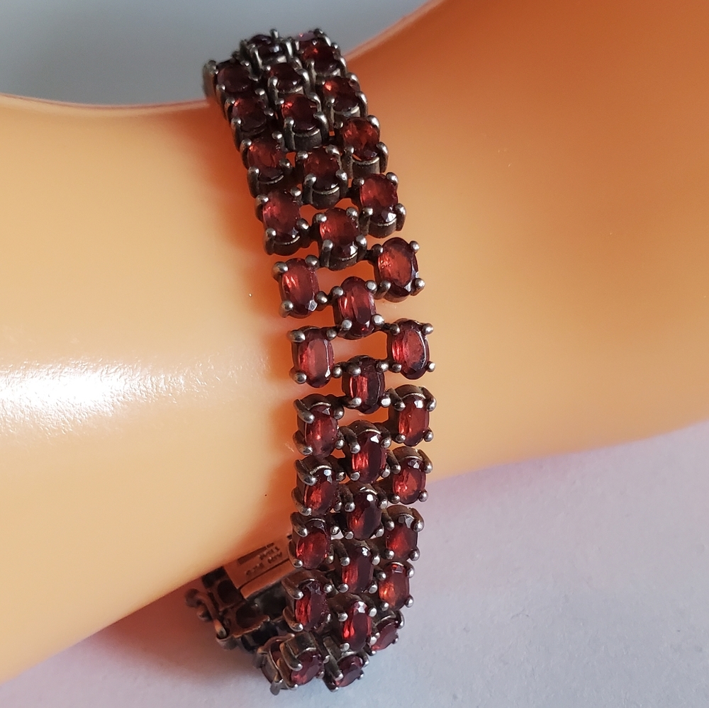 Pre loved condition. Three row authentic Garnet bracelet set in 925 silver.